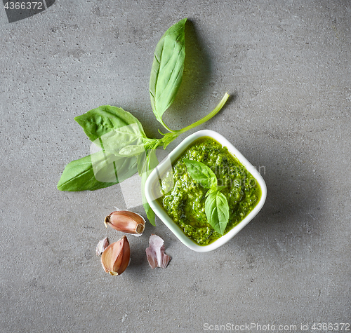 Image of Pesto sauce on grey table