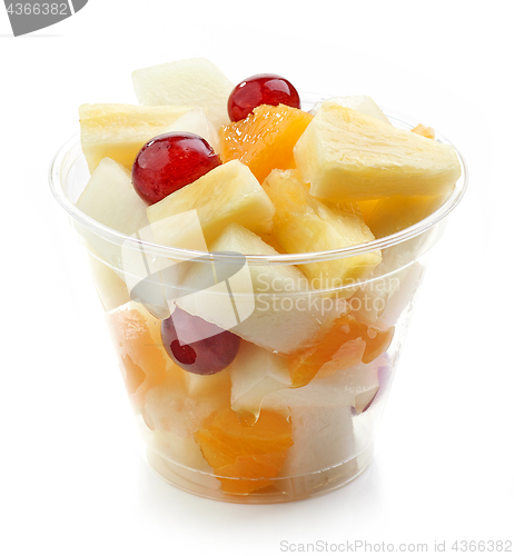Image of fresh fruit pieces salad in plastic cup
