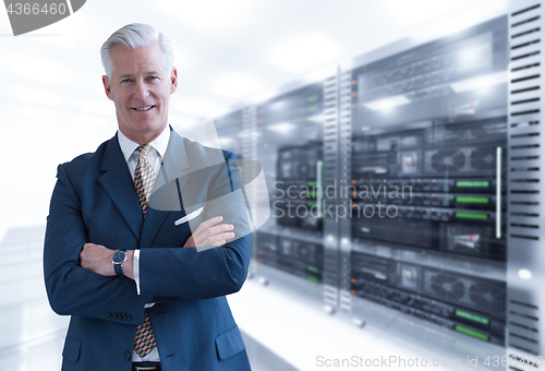 Image of Senior businessman in server room