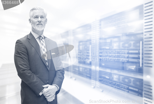 Image of Senior businessman in server room