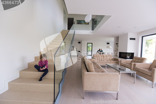 Image of family with little girl enjoys in the modern living room