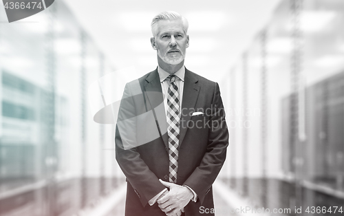 Image of Senior businessman in server room