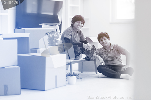 Image of boys with cardboard boxes around them