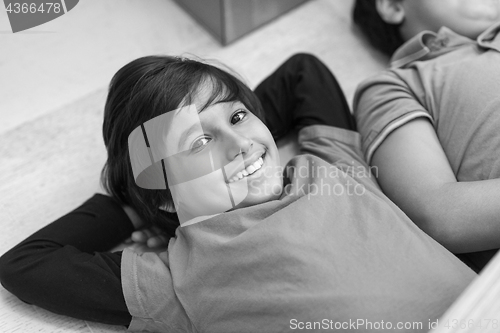 Image of young boys having fun on the floor