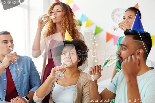 Image of team drinking champagne at office birthday party