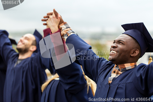 Image of happy students celebrating graduation