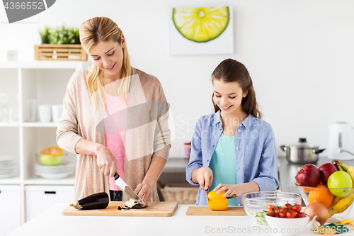 Image of happy family cooking dinner at home kitchen