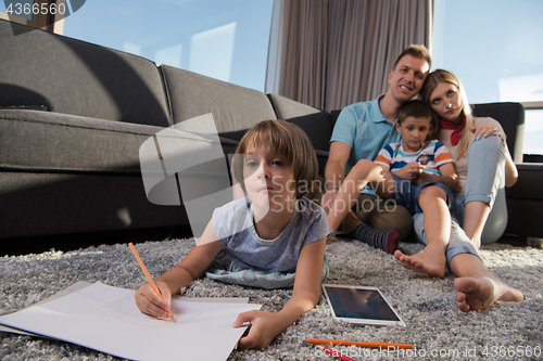 Image of young couple spending time with kids