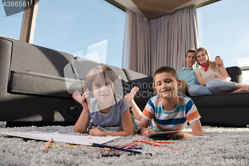 Image of young couple spending time with kids