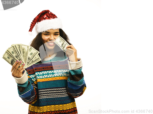 Image of cute young african girl in santas red hat with money isolated