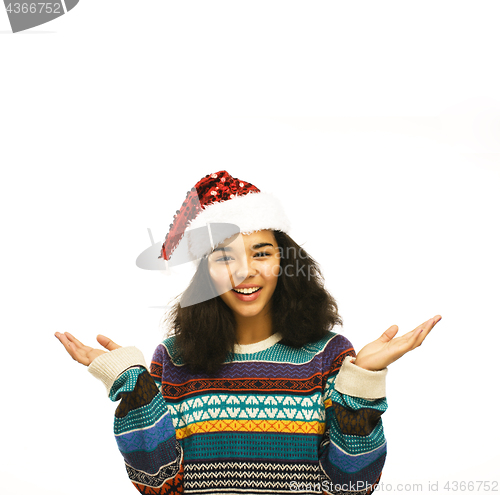 Image of young pretty african american girl in red christmas hat isolated on white