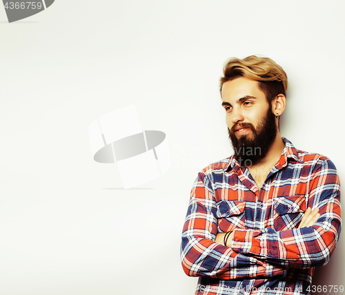 Image of portrait of young bearded hipster guy smiling on white background