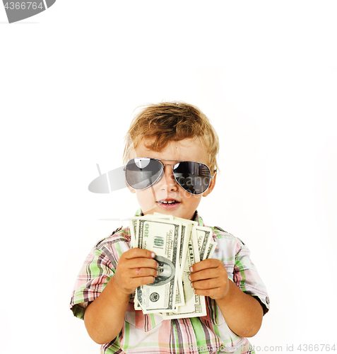 Image of young cute boy holding lot of cash, american dollars isolated close up