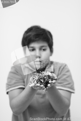 Image of kid blowing confetti