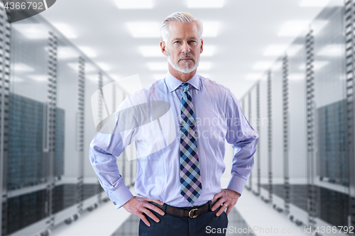 Image of Senior businessman in server room