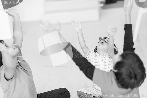 Image of young boys having fun on the floor