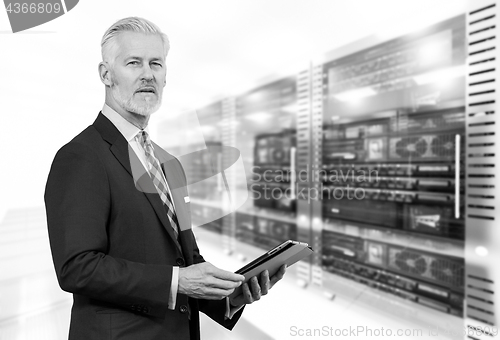 Image of Senior businessman in server room