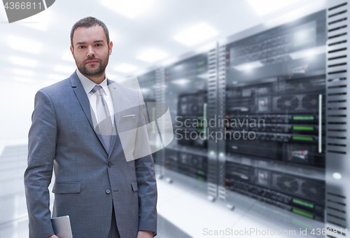 Image of Young businessman in server room