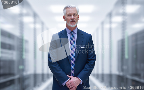 Image of Senior businessman in server room