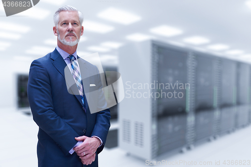 Image of Senior businessman in server room