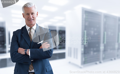 Image of Senior businessman in server room