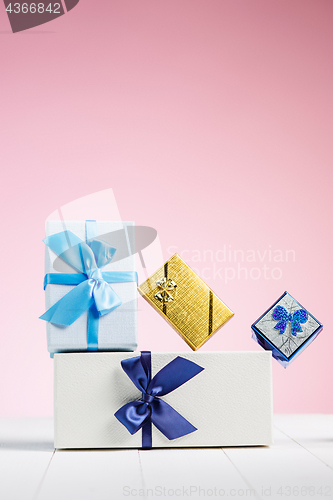 Image of Gift box wrapped in recycled paper with ribbon bow