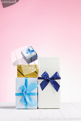 Image of Gift box wrapped in recycled paper with ribbon bow