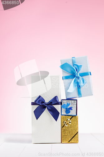 Image of Gift box wrapped in recycled paper with ribbon bow