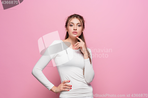 Image of The young woman\'s portrait with proud and arrogant emotions