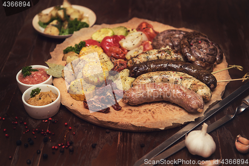 Image of Grilled sausages with vegetables