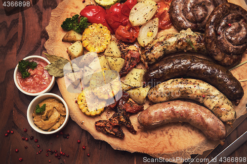 Image of Grilled sausages with vegetables