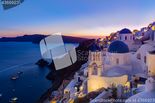 Image of Traditional greek village of Oia at dusk, Santorini island, Greece.