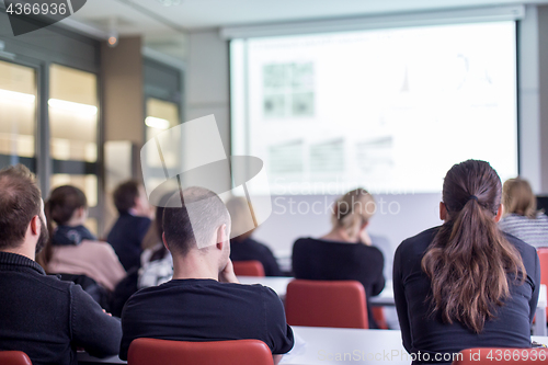 Image of Audience in the lecture hall listening to academic presentation.