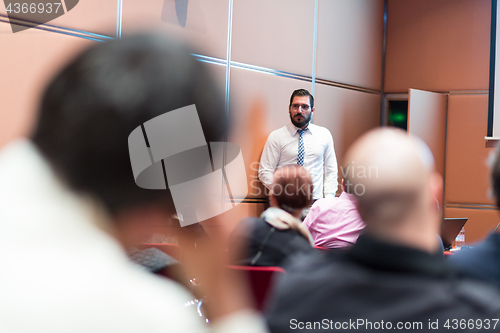 Image of Speaker Giving a Talk at Business Meeting.