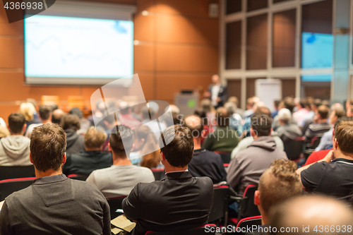 Image of Business speaker giving a talk at business conference event.