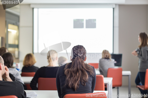 Image of Woman giving presentation on business conference.