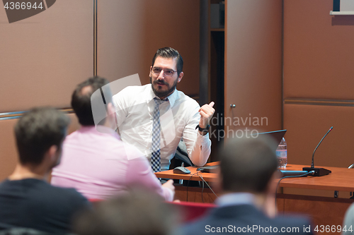 Image of Speaker Giving a Talk at Business Meeting.