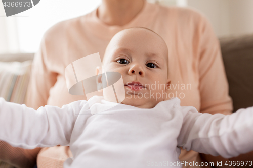 Image of close up of mother with little baby boy at home