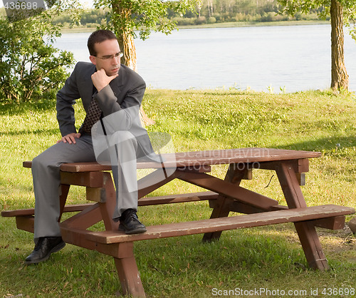 Image of Young Businessman Thinking