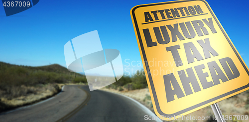 Image of Luxury tax ahead road sign