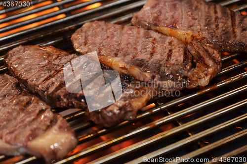 Image of Beef steaks on the grill