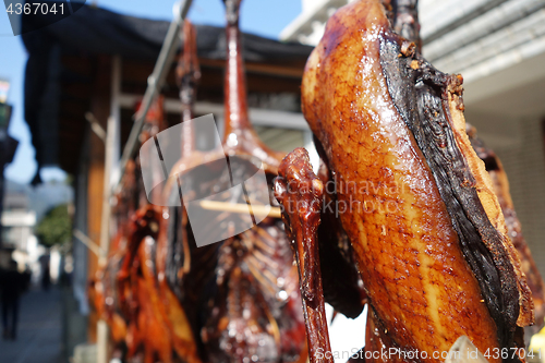 Image of The meat drying outside on the sun