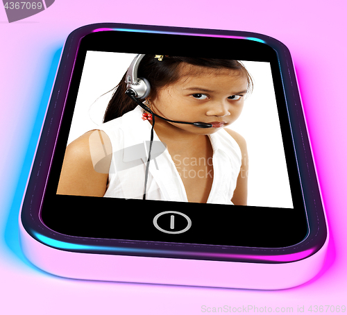 Image of Child With Headset Talking Over The Internet