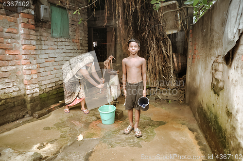 Image of Mother and son in slum in Bangladesh