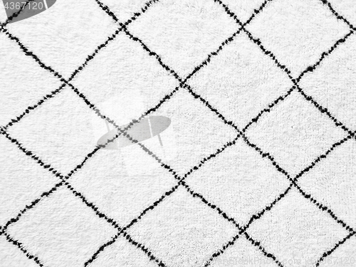 Image of White rug with simple black lines design