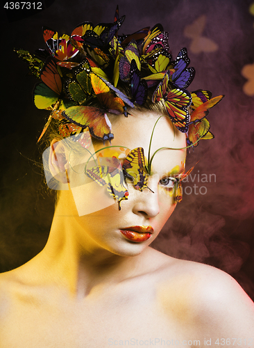 Image of woman with summer creative make up like fairy butterfly closeup 