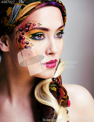 Image of close up portrait of beauty woman with face art