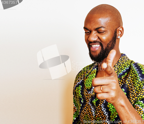 Image of portrait of young handsome african man wearing bright green nati