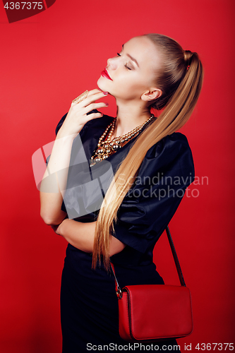 Image of young pretty woman young lady posing on red background, lifestyle people concept