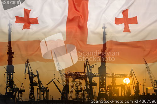 Image of Industrial concept with Georgia flag at sunset